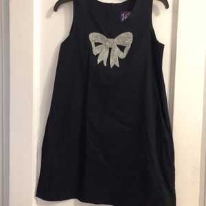 Black babydoll dress with beaded bow detail